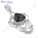 Load image into Gallery viewer, Sterling silver labradorite pendant with a teardrop-shaped gemstone in a detailed silver setting.
