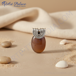 Load image into Gallery viewer, Silver pendant with a brown gemstone, a unique and stylish piece of jewelry.
